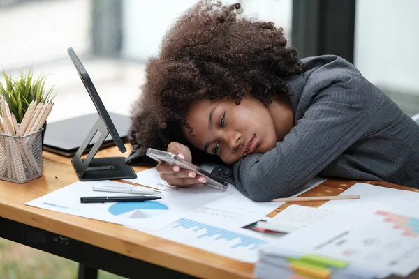 stock image American African Woman working in the office with computer phone and Tablet. High quality photo