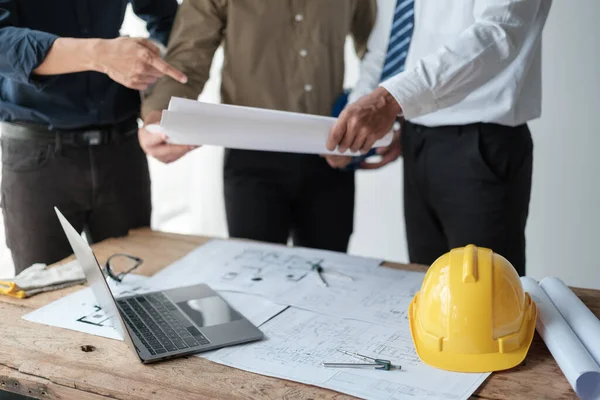 stock image Close up group engineers discussion and planning about project. Brainstorming of engineers. Construction engineering conceptual. Three architects in office and discussing project. High quality photo