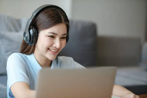 stock image Beautiful asian woman online learning with laptop in living room. High quality photo