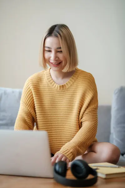 stock image Beautiful asian woman online learning with laptop in living room. High quality photo