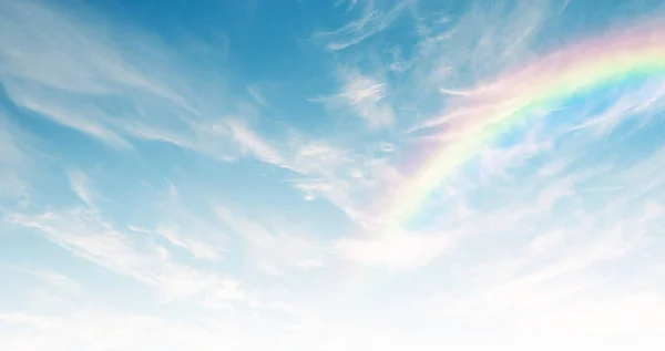 Thin elegant clouds and incredible rainbow in the blue sky. Natural sky background. 3D stretch ceiling decoration image.