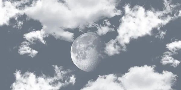 Full moon among the clouds in the gray colored sky.
