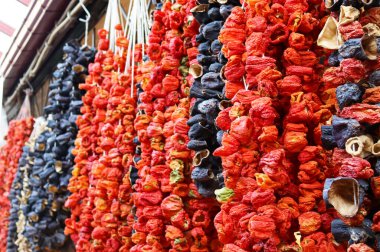 Dried peppers and eggplants hanging in a bazaar market in Ankara, Ulus.