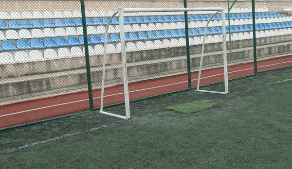 Artificial grass football training field and small football goal.