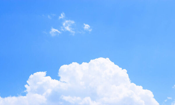 Blue sky background texture. Fluffy big white cloud and fresh air.