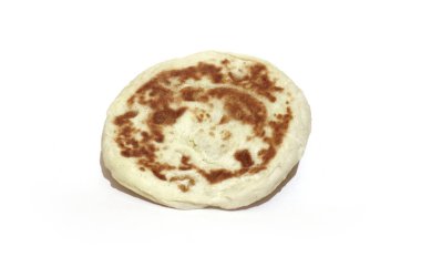 Traditional homemade Turkish Bazlama on a white background. clipart