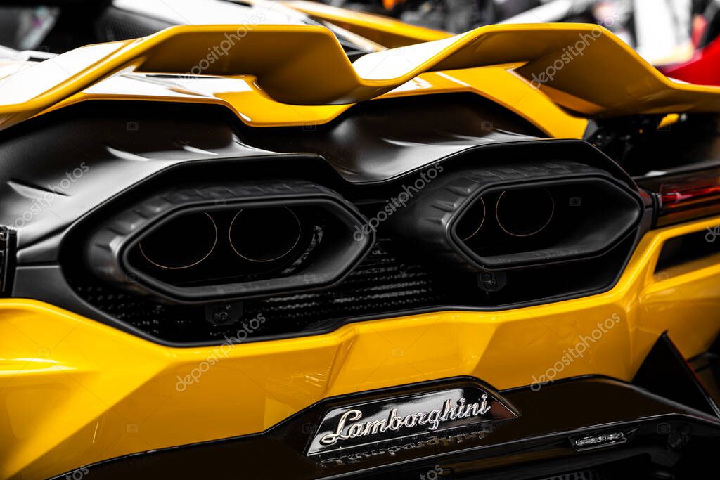 Bangkok, Thailand - January 17, 2025 : Exhaust pipes close up of a yellow Lamborghini sports car showcased in Motor Show