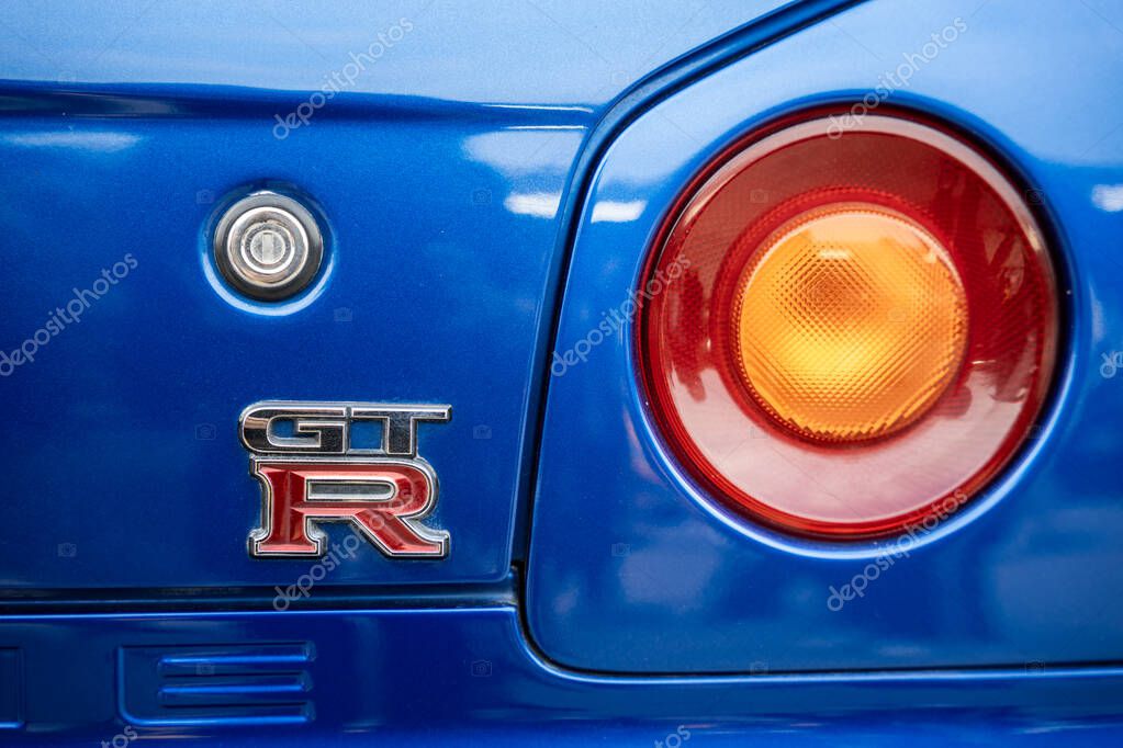 Bangkok, Thailand - January 17, 2025 : Close-up detail view of blue sports Nissan GT-R car tail rear light.