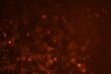 Kırmızı parıltılı klasik ışık arka planı. kırmızı bokeh koyu arkaplanda parlıyor.