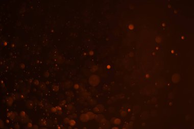 Kırmızı parıltılı klasik ışık arka planı. kırmızı bokeh koyu arkaplanda parlıyor.