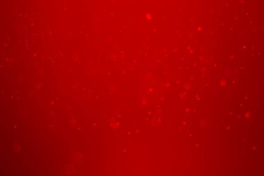 Kırmızı parıltılı klasik ışık arka planı. kırmızı bokeh koyu arkaplanda parlıyor.