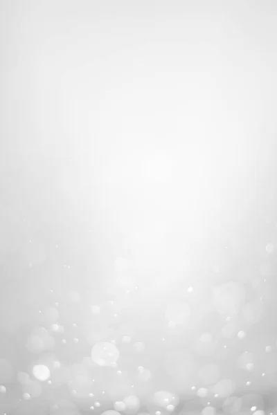 White glitter vintage lights background.  White bokeh shiny on dark background. Vertical photos