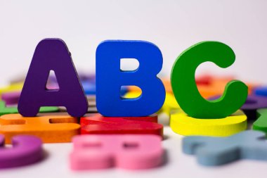 Multi-colored English characters on a white background. The concept of thinking development, grammar