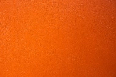 Ev duvarı turuncuya boyanmış Turuncu duvar dokusu arkaplanı