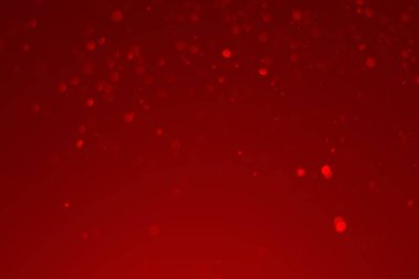 Kırmızı parıltılı klasik ışık arka planı. kırmızı bokeh koyu arkaplanda parlıyor.