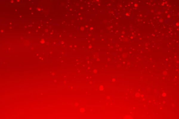 Kırmızı parıltılı klasik ışık arka planı. kırmızı bokeh koyu arkaplanda parlıyor.
