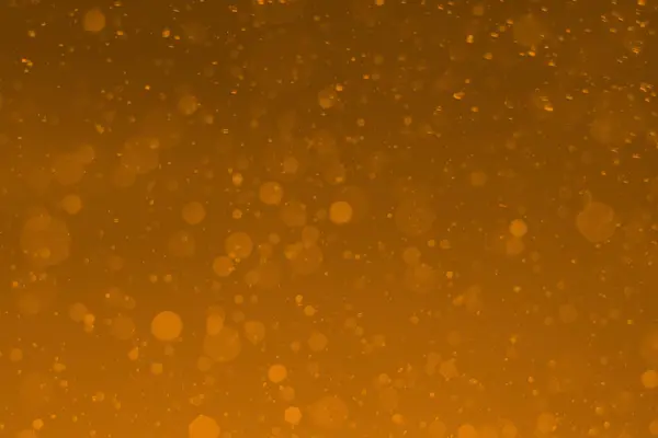 Sarı parıltılı klasik ışık arka planı. sarı bokeh koyu arkaplanda parlıyor.
