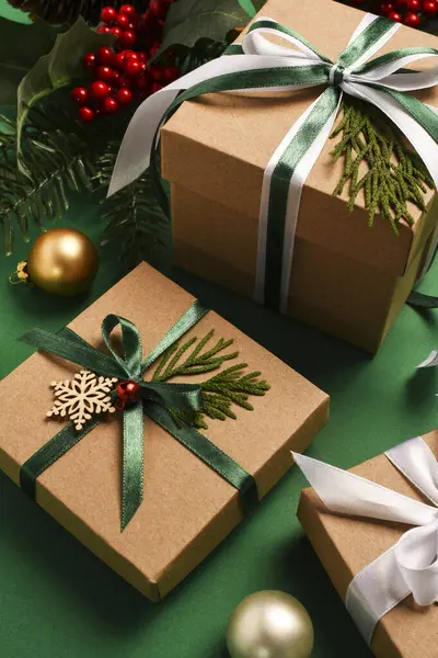 Christmas Green Background.Christmas boxes with gifts and Christmas decoration