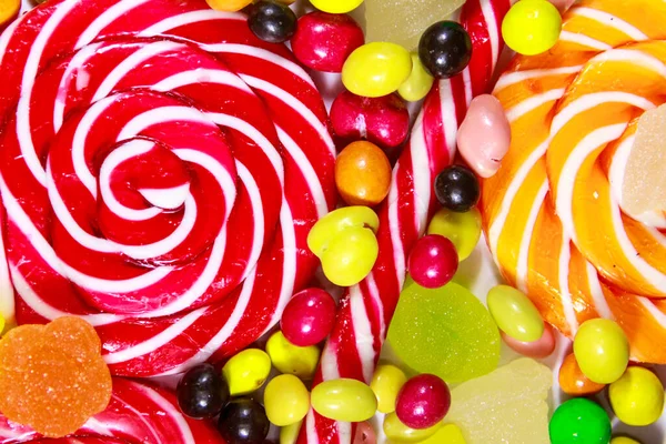 Renkli Çikolata Şekerleri Lolipoplar Şeker Kamışı Jöleli Şekerlerin Arka Planı — Stok fotoğraf