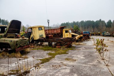 Old rusty abandoned damaged trucks in Chernobyl exclusion zone, Ukraine