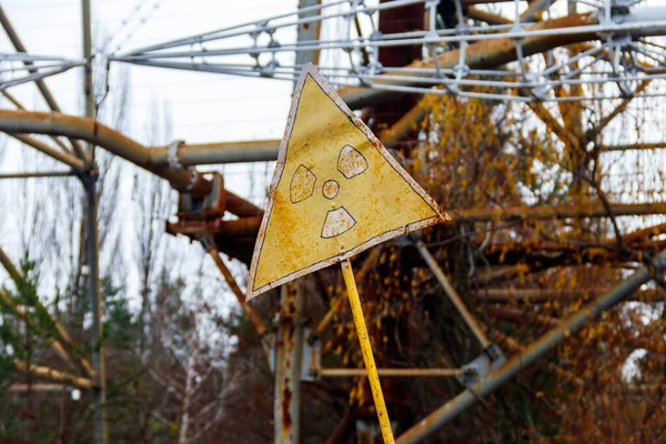 Radiation warning sign in front of Duga, a Soviet over-the-horizon (OTH) radar system as part of the Soviet anti-ballistic missile early-warning network, inside the Chernobyl Exclusion Zone in Ukraine