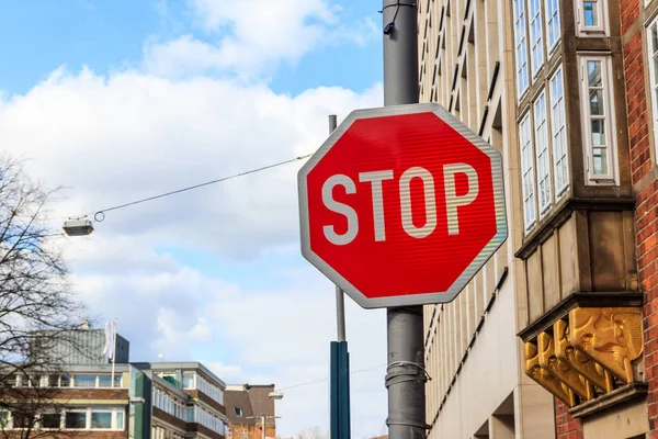 Red Stop sign on a city street