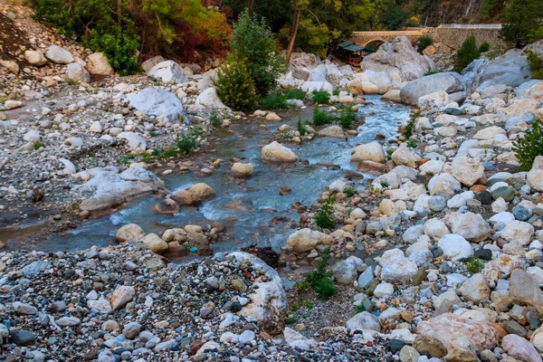 stock image Ancient stone bridge across a mountain river in Kesme Bogaz canyon, Antalya province in Turkey