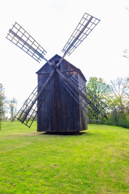 Old wooden windmill in Open-air Museum of Folk Architecture and Folkways of Middle Naddnipryanschina in Pereyaslav, Ukraine clipart