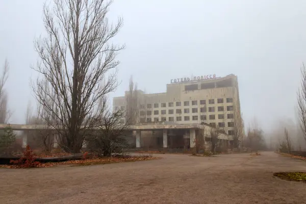 stock image Abandoned building of Polissya hotel in the ghost town Pripyat in Chernobyl Exclusion Zone, Ukraine. Inscription in Ukrainian: Hotel Polissya