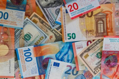 Multicurrency background of US dollars, euros and Swiss francs