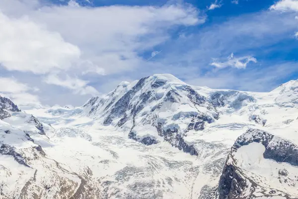 stock image Magnificent panorama of the Pennine Alps with famous Gorner Glacier and impressive snow capped mountains Monte Rosa Massif close to Zermatt, Switzerland