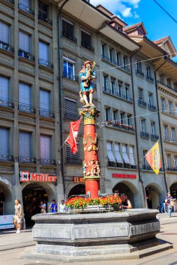 Bern, Switzerland - June 25, 2022: Piper Fountain (Pfeiferbrunnen) in the old city of Bern, Switzerland. The fountain was built in 1545-1546. Author Hans Ging clipart