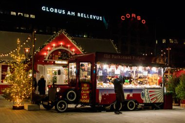 Zurich, Switzerland - December 8, 2022: Truck selling food and drinks at Christmas Market in Zurich, Switzerland clipart