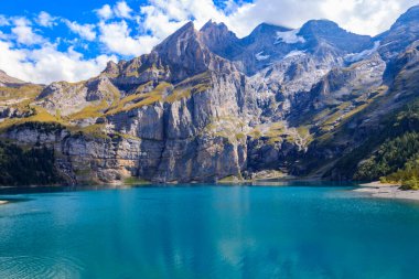 View of Oeschinen lake (Oeschinensee) and Swiss Alps near Kandersteg in Bernese Oberland, Switzerland clipart