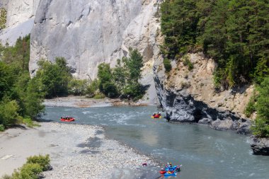 Grisons, Switzerland - July 15, 2023: Groups of people rafting in Ruinaulta canyon (Swiss Grand Canyon) in Grisons (Graubunden) canton, Switzerland clipart