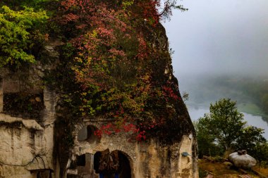 Lyadovsky rocky monastery is a male monastery located on a rocky terrace of the 90-meter high mountain over the Dniester river on its left bank, near Lyadova village in Vinnytsya region, Ukraine clipart