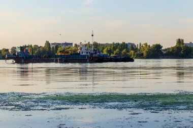 Industrial ship on the Dnieper river in Kremenchug, Ukraine clipart