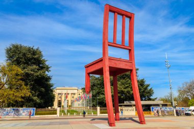 Geneva, Switzerland - April 11, 2022: Broken Chair Monument on Square of Nations in front of Palace of United nations building in Geneva, Switzerland. Dedicated to all victims of land mines. Artist Daniel Berset and Louis Geneve