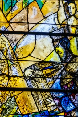 Zurich, Switzerland  - April 19, 2022: Stained glass window of the Protestant church Fraumunster designed by Marc Chagall in Zurich, Switzerland clipart