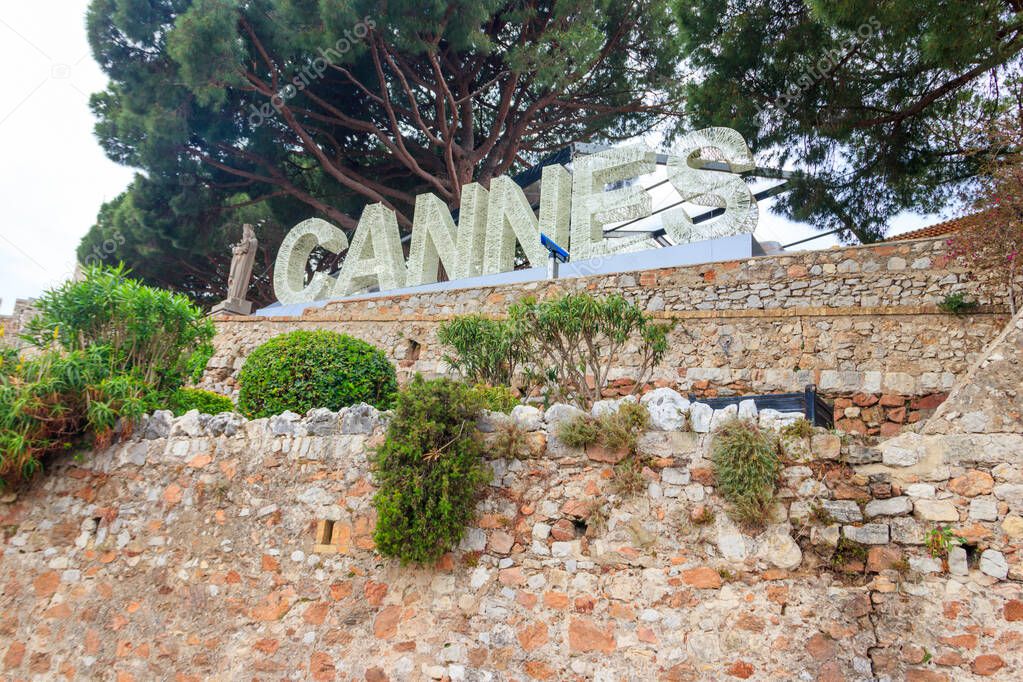 The sign Cannes on the top of the hill in Cannes, French Riviera, France