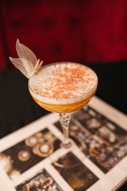 close up of a glass of coffee with ice cream and a cup of tea