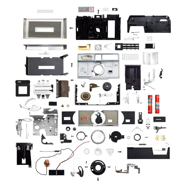 stock image Instamatic 300 camera shown in pieces on a white background