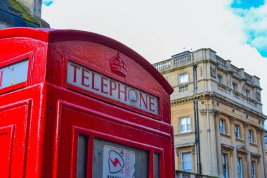 UK, Bath, 05.26.2024: Red telephone box, its upper part with the inscription 'TELEPHONE' clipart