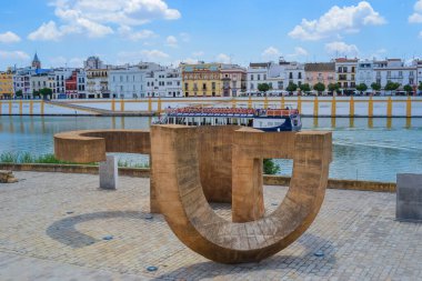 27.05.2023, Seville, Spain: Sculpture called 'Monumento a la Tolerancia' located on the waterfront close to popular location as it is close to the main attractions  clipart