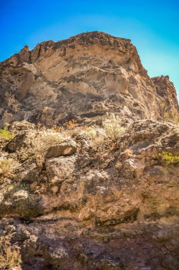 Mountains of the island of Gran Canaria, originally - this is a volcano and the landscape was formed as a result of its activity clipart