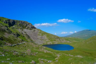 Snowdonia National Park, Epic views of mountains and valleys with blue lakes and crystal clear water clipart