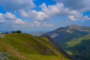 Snowdonia National Park, Epic views of mountains and valleys with blue lakes and crystal clear water clipart