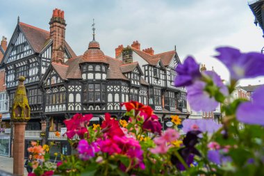 UK, Chester: the main street of the historic center with shops, pubs, cafes, bars clipart