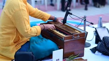 the musician plays the harmony. Indian Harmony Classical Music Instrument. Fingers Close Up. Performance Player