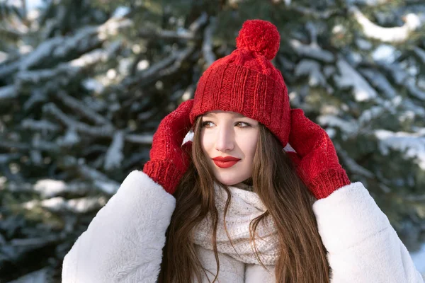 Beautiful Young Girl Straightens Hat Winter Park Snowy Pine Trees — Fotografia de Stock